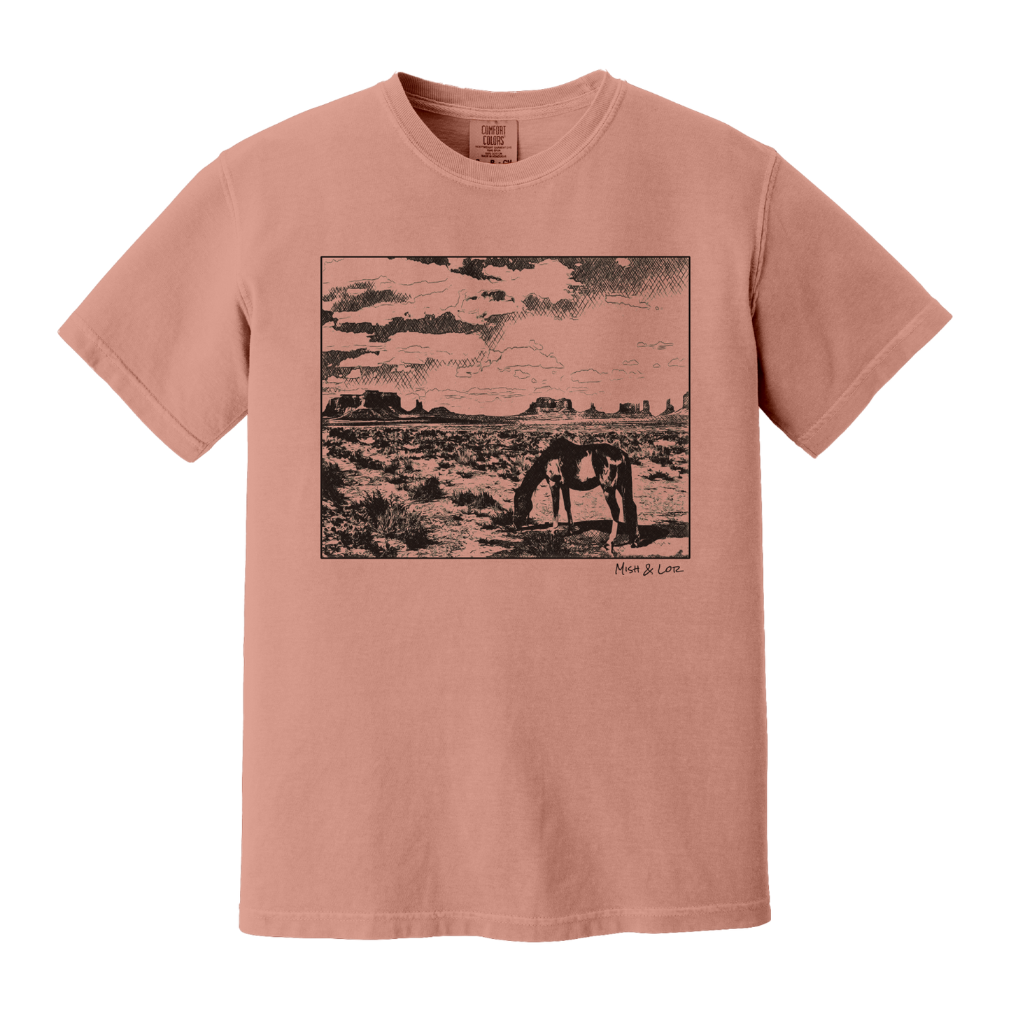 Desert Horse t-shirt in Terracotta (coral), with a lone horse grazing before desert buttes under a softly clouded southwestern sky.