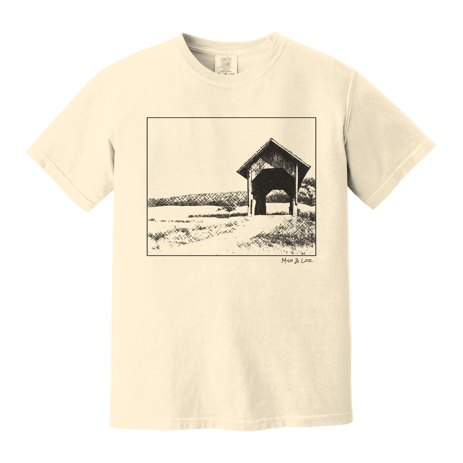 Front view of the Covered Bridge cotton t‑shirt in Ivory (cream), with a storybook scene of a rustic covered bridge arching over a quiet Vermont dirt road.