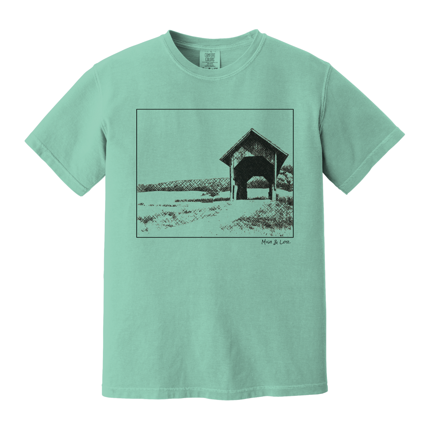 Front view of the Covered Bridge cotton t‑shirt in Seafoam (teal), with a storybook scene of a rustic covered bridge arching over a quiet Vermont dirt road.