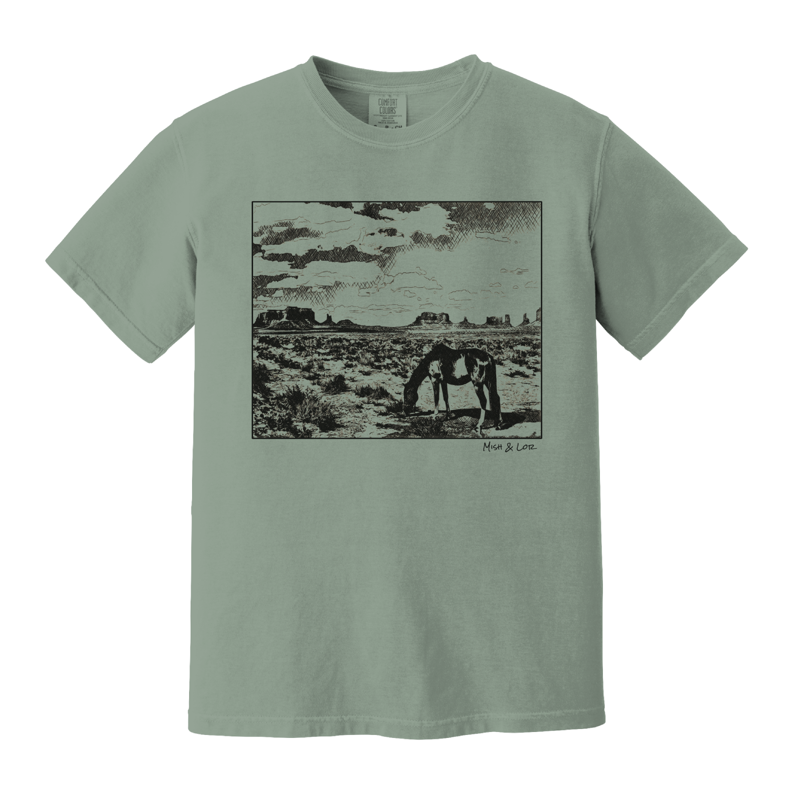 Desert Horse t-shirt in Bay (green), with a lone horse grazing before desert buttes under a softly clouded southwestern sky.