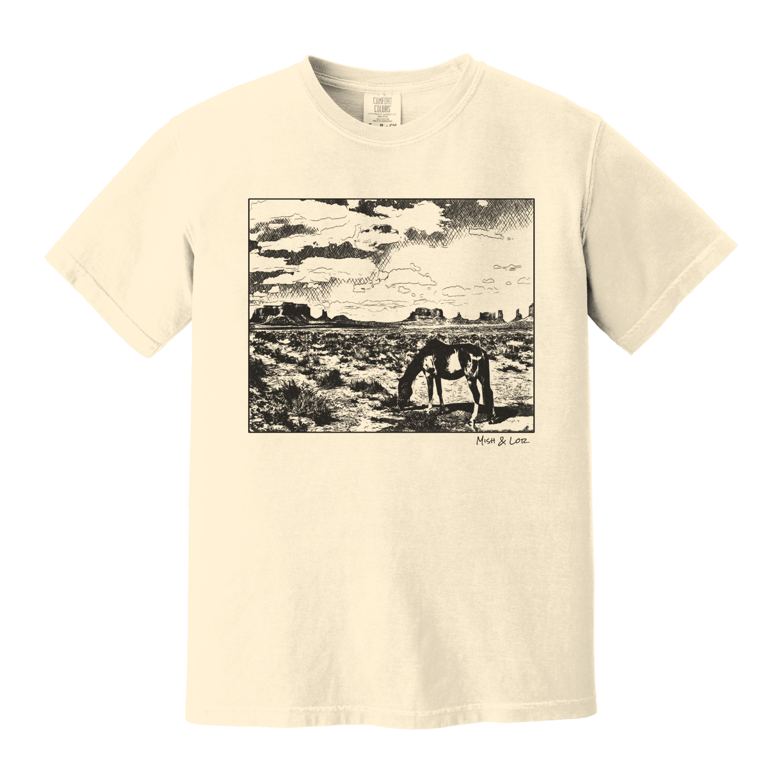 Desert Horse t-shirt in Ivory (cream), with a lone horse grazing before desert buttes under a softly clouded southwestern sky.