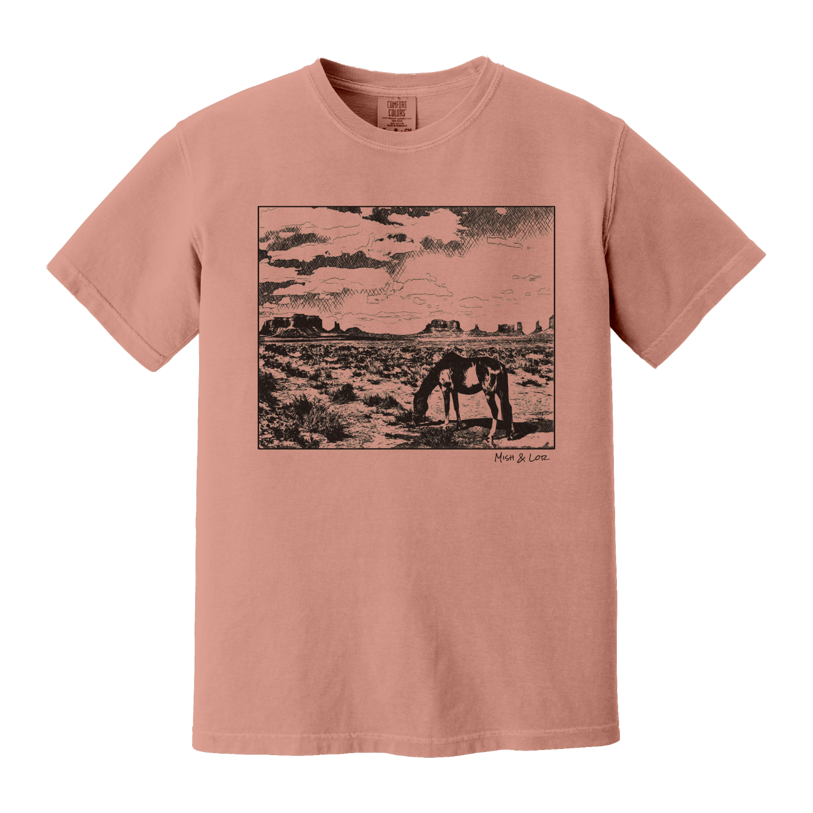 Desert Horse t-shirt in Terracotta (coral), with a lone horse grazing before desert buttes under a softly clouded southwestern sky.