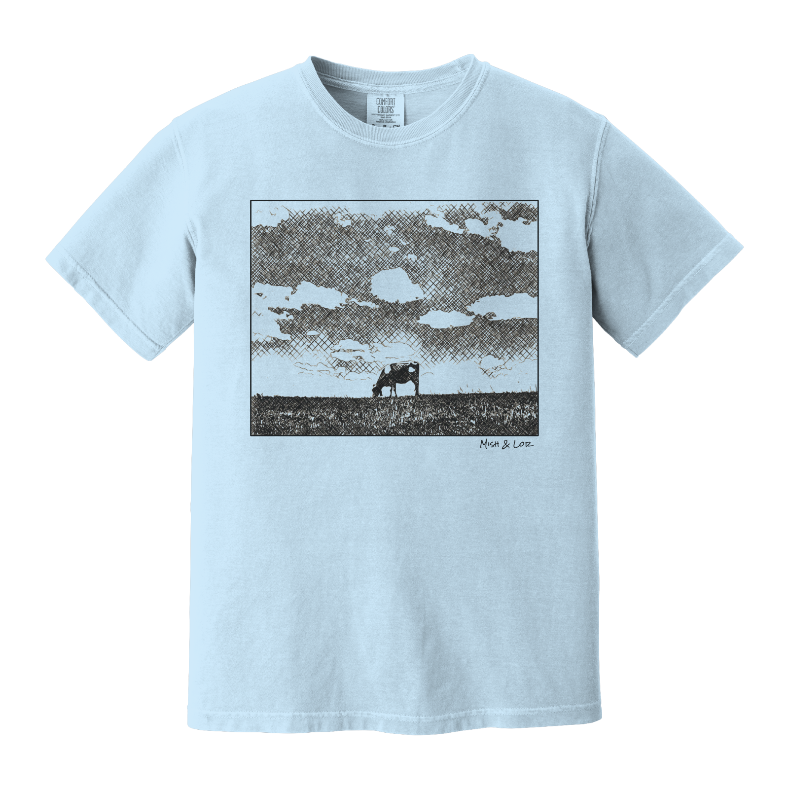 Front view of the Field Cow Cotton T-Shirt in Chambray (baby blue) featuring  a whimsical black-and-white rendering of a lone cow grazing in a field beneath a cloud-dotted sky